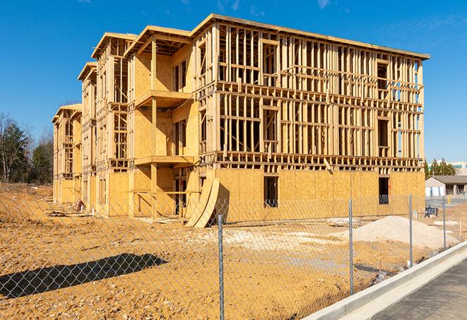 a snapshot of temporary chain link fences protecting a large construction project from unauthorized access in Inglewood